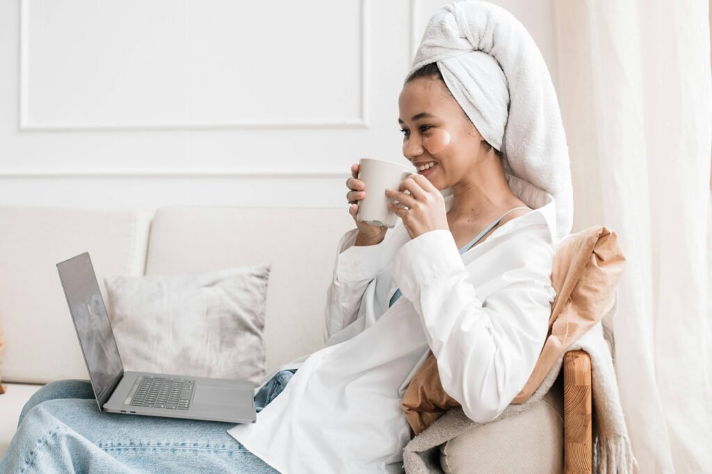 personal happily browsing online therapy on their laptoip