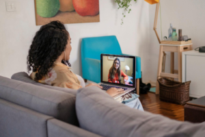 Minority professional attending online therapy session